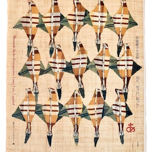 May include: A textile artwork featuring a repeating pattern of stylized bird-like figures in shades of brown, tan, and blue-green. The artwork includes Japanese text and English text that reads "Miyawaki Ayako Retrospective: I saw, I cut, I applied."