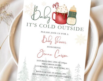 May include: A rectangular baby shower invitation card featuring the text Baby IT'S COLD OUTSIDE, a red mug with whipped cream and candy canes, a baby bottle, snowflakes, and pine trees. The card includes event details for Jenna Carson.