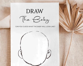 May include: A white card with the text "DRAW The Baby" in a script font. Below the text is a drawing of a baby's head with the prompt "CAN YOU GUESS WHAT THE BABY WILL LOOK LIKE?" in a simple font. The card is for a baby shower game.