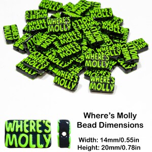 May include: A pile of black and green plastic beads with the words "Where's Molly" printed on them. The beads are 14mm wide, 20mm high, and have a 2mm hole.