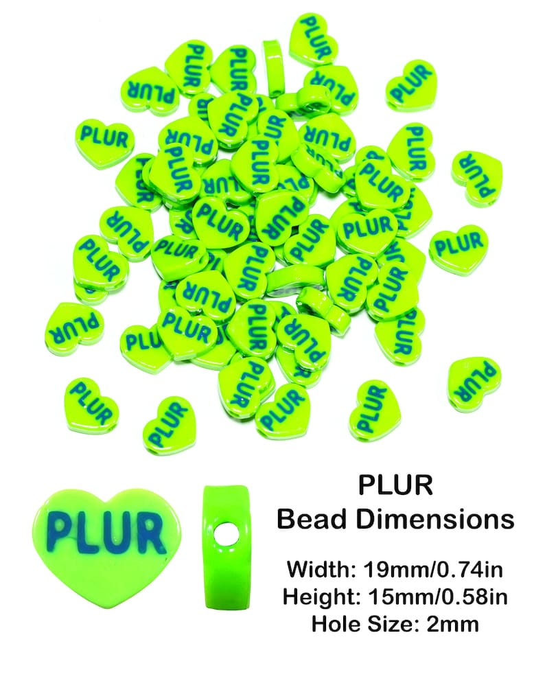 May include: A large quantity of bright green heart-shaped beads with the word "PLUR" printed in blue on each bead. The beads are arranged in a random pattern on a white background. The image also includes a close-up of a single bead and a bead with a hole in the center. The text "PLUR Bead Dimensions" is printed below the beads, along with the dimensions: Width: 19mm/0.74in, Height: 15mm/0.58in, Hole Size: 2mm.