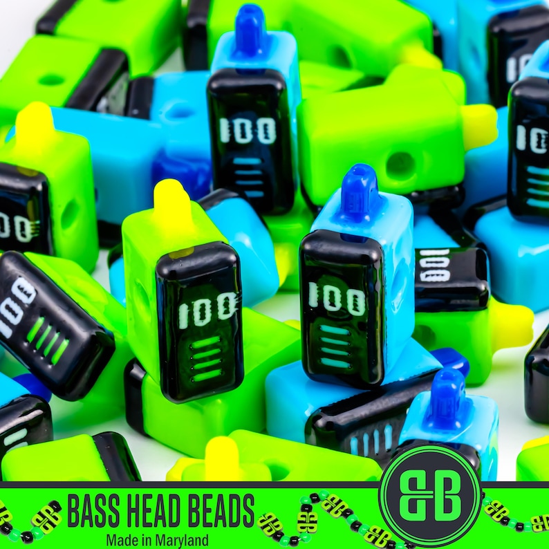 May include: A collection of colorful, plastic beads in shades of blue, green, and yellow. Each bead has a black screen displaying "100" and a battery indicator. The beads are labeled "BASS HEAD BEADS" and "Made in Maryland".