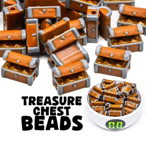 May include: A large pile of brown and gray treasure chest beads. The beads are made of plastic and have a realistic design. The beads are in a white bowl with the text "Treasure Chest Beads" printed below the bowl.