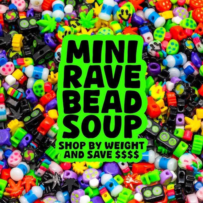 May include: A vibrant assortment of colorful beads in various shapes and sizes, including smiley faces, stars, and other novelty designs. A neon green sign reads "MINI RAVE BEAD SOUP" with the text "SHOP BY WEIGHT AND SAVE $$$" below.
