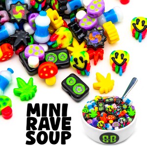 May include: A collection of colorful, miniature rave-themed charms and beads. The image includes smiley faces, mushrooms, and other playful designs. A bowl filled with charms is shown with the text "MINI RAVE SOUP".