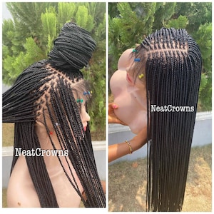 May include: Two images of a black braided wig. The wig is styled with small, neat braids. One image shows the wig styled in a bun, while the other shows the wig with long, flowing braids. The text "Neat Crowns" is visible.