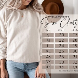 K&ouml;nnte beinhalten: Gr&ouml;&szlig;entabelle f&uuml;r Unisex-Sweatshirt mit Ma&szlig;en in Zoll. Die Tabelle zeigt die Breite und L&auml;nge des Sweatshirts in den Gr&ouml;&szlig;en S, M, L, XL, 2X, 3X und 4X.