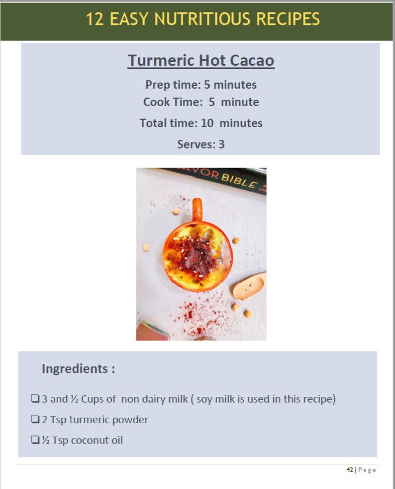 May include: A close-up of a red mug filled with a yellow and orange drink topped with red powder. The mug is on a white surface with a wooden spoon and yellow beans. The text "AVOR BIBLE" is visible on a book in the background. The recipe title "Turmeric Hot Cacao" is at the top of the image. The ingredients are listed below: 3 and 1/2 Cups of non dairy milk (soy milk is used in this recipe), 2 Tsp turmeric powder, 1/2 Tsp coconut oil.
