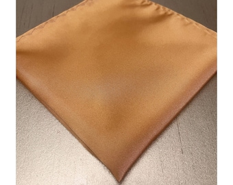 May include: A solid gold-colored pocket square made of satin fabric.
