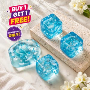 May include: Four translucent blue cubes and one rounded shape, all with white floral patterns, are displayed on a light-colored surface. The image includes text that reads "BUY 1 GET 1 FREE!" and "LIMITED TIME ONLY!"