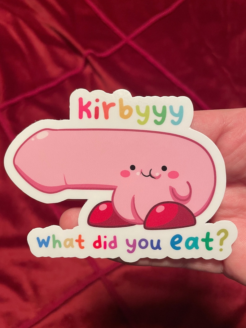 May include: A white sticker with a pink cartoon character with red shoes and the text "kirbyyy what did you eat?" in rainbow colors.