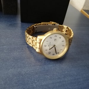 waterproof stainles steel gold watch bought one year ago