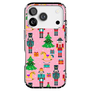 May include: A pink phone case with a festive Christmas pattern. The design includes nutcrackers, Christmas trees, gift boxes, and rocking horses. The case has a clear border and is designed to fit a smartphone.