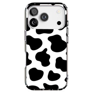 May include: A clear phone case with a black and white cow print design. The case has a glossy finish and a protective bumper. The phone case is designed to fit a smartphone and has cutouts for the camera and buttons.
