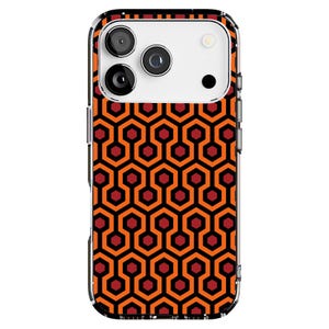 May include: Clear phone case with a repeating geometric pattern in orange, black, and red. The case has a clear border and a camera cutout. The pattern is a series of interconnected hexagons.
