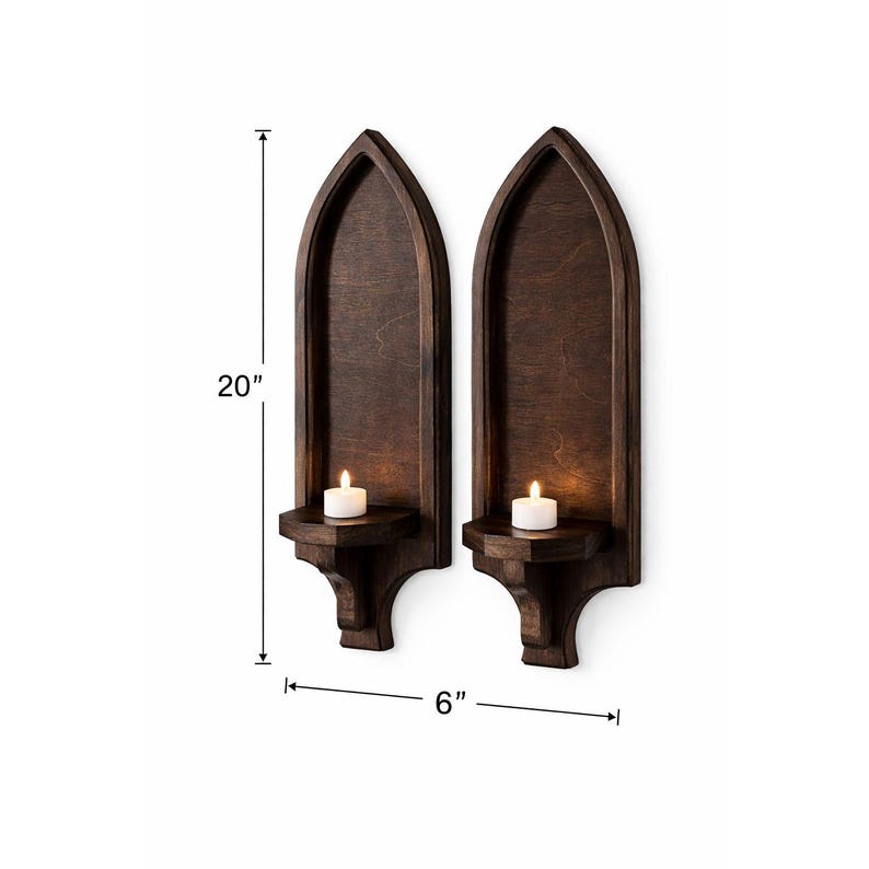 Gothic arch wall sconce, 20 inches tall, with candle shelf holding a lit candle