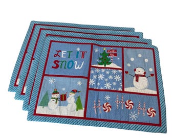 Juego de 4 manteles individuales navideños con diseño de muñeco de nieve de St Nicholas Square en color azul.
