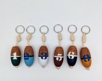 Key ring buoy numbered made of cork floating in different designs