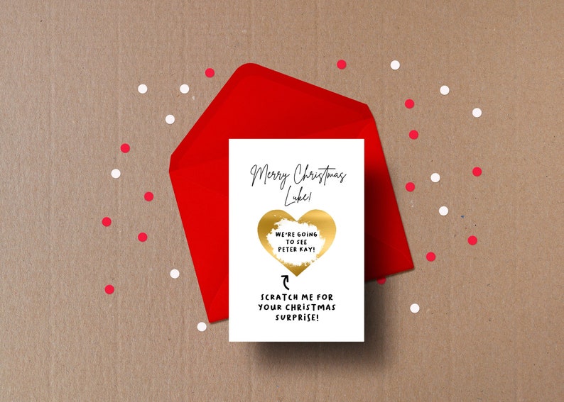 The card reads 'Merry Christmas' followed by your chosen name.
Below is a Heart that can be scratched off to reveal a secret message underneath.
Below that is an arrow pointing to the heart reading 'scratch me'