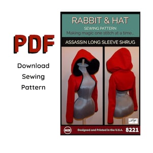 May include: A sewing pattern for a red hooded shrug with long sleeves. The pattern is titled "Rabbit & Hat Sewing Pattern: Making magic one stitch at a time... Assassin Long Sleeve Shrug" and has the number 8221.