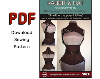 May include: A sewing pattern for a brown corset with a neck harness and side-tie under bust. The pattern is called "Rabbit & Hat" and includes the text "Dwell in the possibilities".
