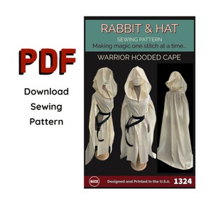 May include: A sewing pattern for a warrior hooded cape. The pattern is for a white hooded cape with a black belt. The pattern is designed and printed in the U.S.A. and the pattern number is 1324.