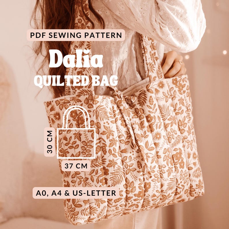May include: A quilted tote bag with a floral pattern in shades of brown and cream. The bag is 14.5 inches wide and 11.8 inches tall. Text on the image reads "Dalia QUILTED BAG" and "PDF SEWING PATTERN".