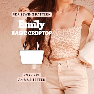 以下が含まれることがあります： 「Emily Basic Crop Top」のPDFソーイングパターンが表示されています。画像には、ベージュのレオパード柄クロップトップと明るい色のジーンズを着た女性が写っています。パターンにはXXS-XXLサイズが含まれており、A4およびUSレター形式で利用できます。