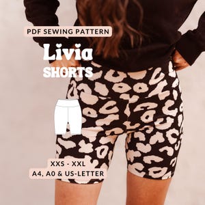 May include: A PDF sewing pattern for Livia shorts featuring a black and cream leopard print design. The graphic includes the text PDF SEWING PATTERN, Livia SHORTS, XXS - XXL, and A4, A0 & US-LETTER, along with a white line drawing of the shorts.