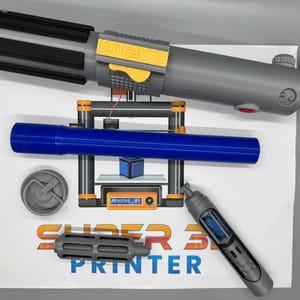 May include: A 3D printed lightsaber, a blue plastic tube, a gray plastic cap, a gray plastic nozzle, and a gray plastic tube with a blue plastic insert. The items are on a white surface with the text "SUPER 3D PRINTER" printed on it.