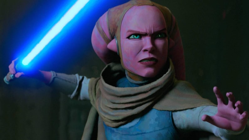 May include: A pink-skinned character with green eyes holds a glowing blue lightsaber. She wears a blue and tan outfit with a tan scarf. Her expression is one of intense focus, with a furrowed brow and a determined gaze.