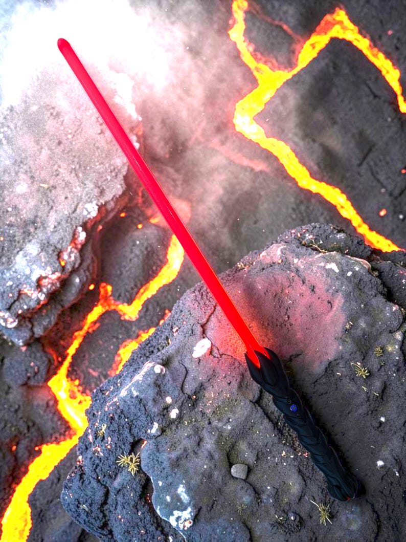 May include: A red lightsaber with a black handle, resting on a dark, textured surface with a lava-like background. The lightsaber's blade glows brightly, contrasting with the dark handle and the fiery backdrop.
