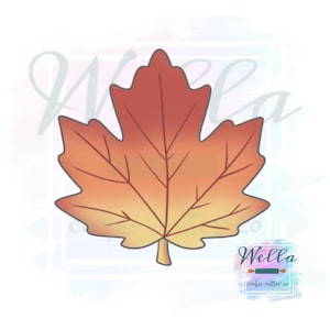 May include: A red, orange, and yellow maple leaf cookie cutter. The cutter is shaped like a maple leaf with a pointed tip and a rounded base. The leaf has a detailed vein pattern.