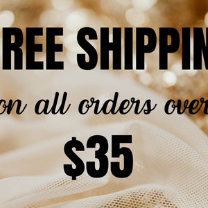 May include: Free shipping on all orders over $35. Text is displayed on a white fabric background with gold glitter.