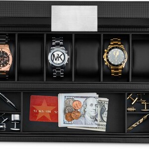 May include: Black leather watch box with a silver metal top. The box has two levels. The top level has five slots for watches. The bottom level has a slot for a credit card, a slot for cash, and a slot for cufflinks. The box is closed.