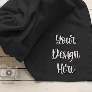 May include: Black fleece blanket mockup with the text "Your Design Here" in white.