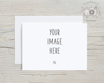 May include: A white card with the text "YOUR IMAGE HERE" and "A6" printed on it. The card is sitting on a light wood surface.
