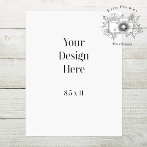 May include: A white 8.5 x 11 inch sheet of paper with the text "Your Design Here" and the dimensions "8.5 x 11" printed on it. The paper is on a white wood background.