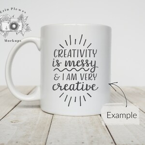 May include: White ceramic mug with a black design that reads "Creativity is messy & I am very creative".