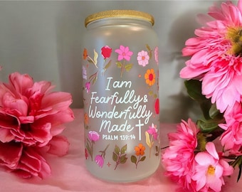 May include: A frosted glass jar with a gold lid and a floral design. The jar has the text "I am Fearfully & Wonderfully Made" and "Psalm 139:14" printed on it.