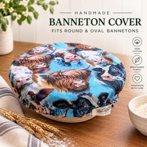 May include: A round fabric banneton cover featuring a colorful print of various cow breeds on a bright blue background. The cover has an elasticized edge and a small white fabric tag labeled ByLuftyJch. Text on the image reads HANDMADE BANNETON COVER.