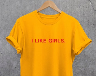 May include: A yellow t-shirt with the text "I LIKE GIRLS." printed in red.