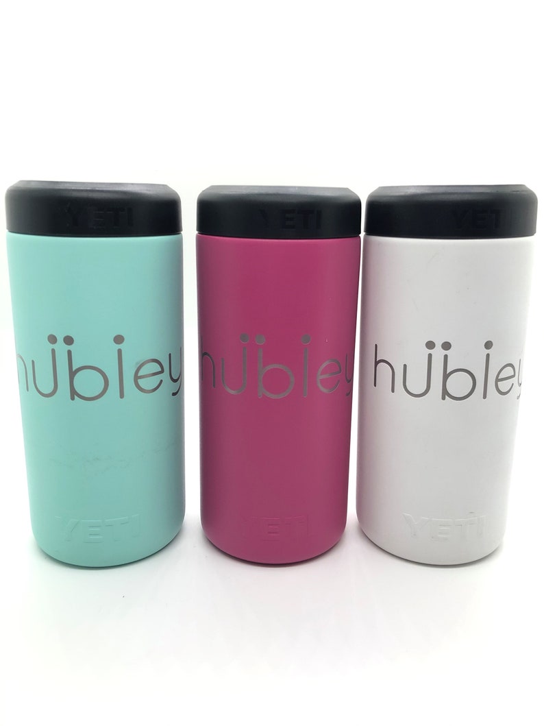 May include: Three Yeti Rambler 12 oz.  can coolers in mint green, pink, and white with the word "hubley" printed on the side.