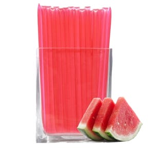 May include: A clear glass vase filled with pink reusable drinking straws. Three slices of watermelon are in front of the vase.