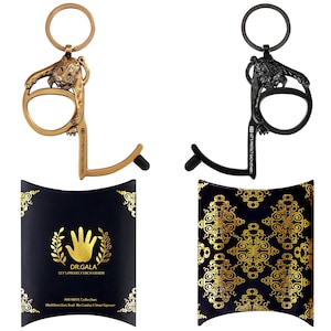 May include: Two door openers with a lion design. One is gold and the other is black. Both have a keychain and the text "Let's protect each other" on them. The openers are packaged in black pouches with gold designs.