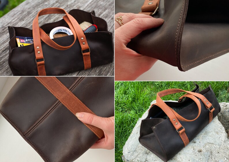 Pode incluir: Uma bolsa de ferramentas de couro castanho escuro com duas al&ccedil;as de couro castanho claro fixadas com rebites de metal. A bolsa tem uma base retangular, design aberto no topo, costuras vis&iacute;veis nas bordas e um acabamento fosco e liso.