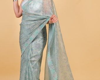 Net saree with print, swarosvki and sequin work - blue color