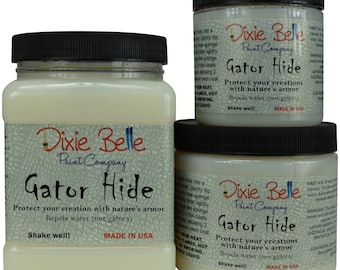 May include: Three jars of Dixie Belle Paint Company Gator Hide protectant. The jars are labeled with the product name and instructions to shake well. The jars are made in the USA.