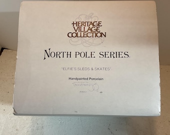 Dept. 56 North Pole Series “ Elfie’s Sleds & Skates  w/Light Kit