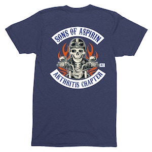 May include: A navy blue t-shirt with a white patch on the back that says "Sons of Aspirin MC Arthritis Chapter". The patch features a skull riding a motorcycle with flames behind it.